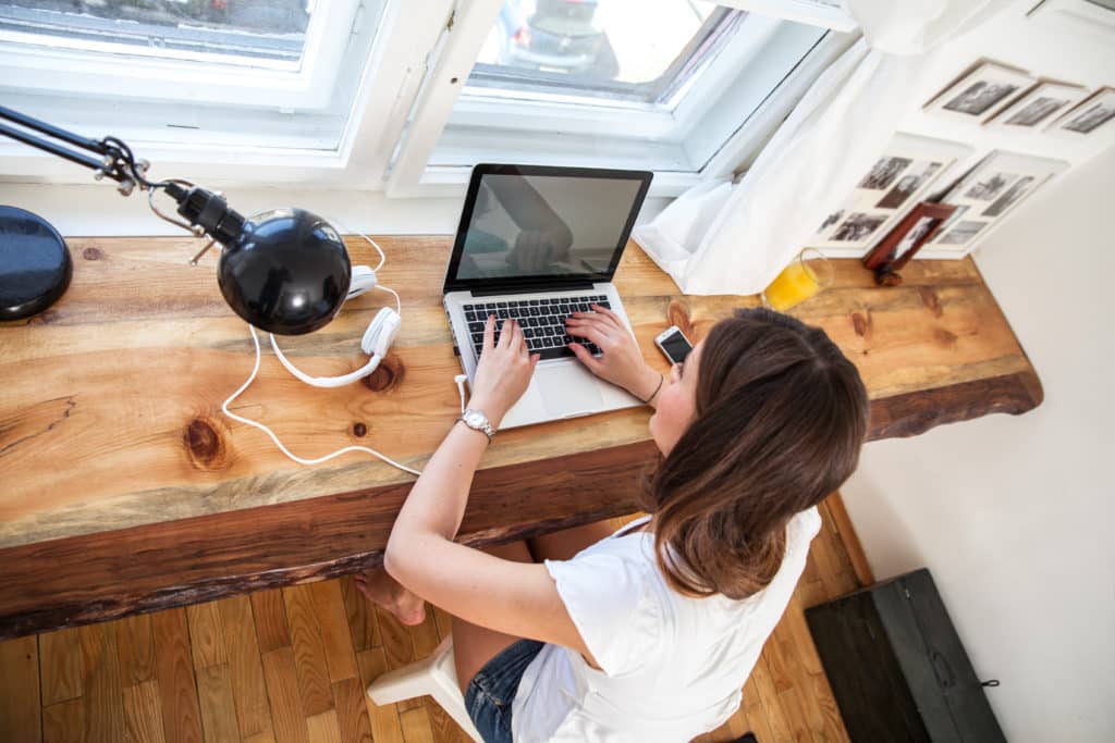 person typing on a computer